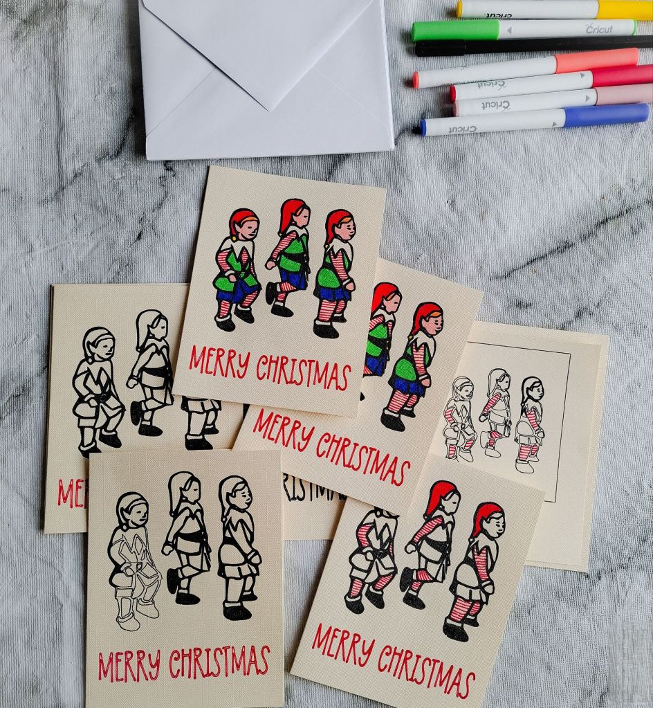 Several Little Elves homemade Christmas cards partially inked and coloured
