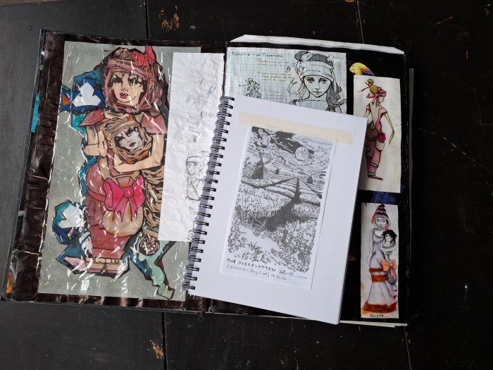 Open sketchbooks and notes